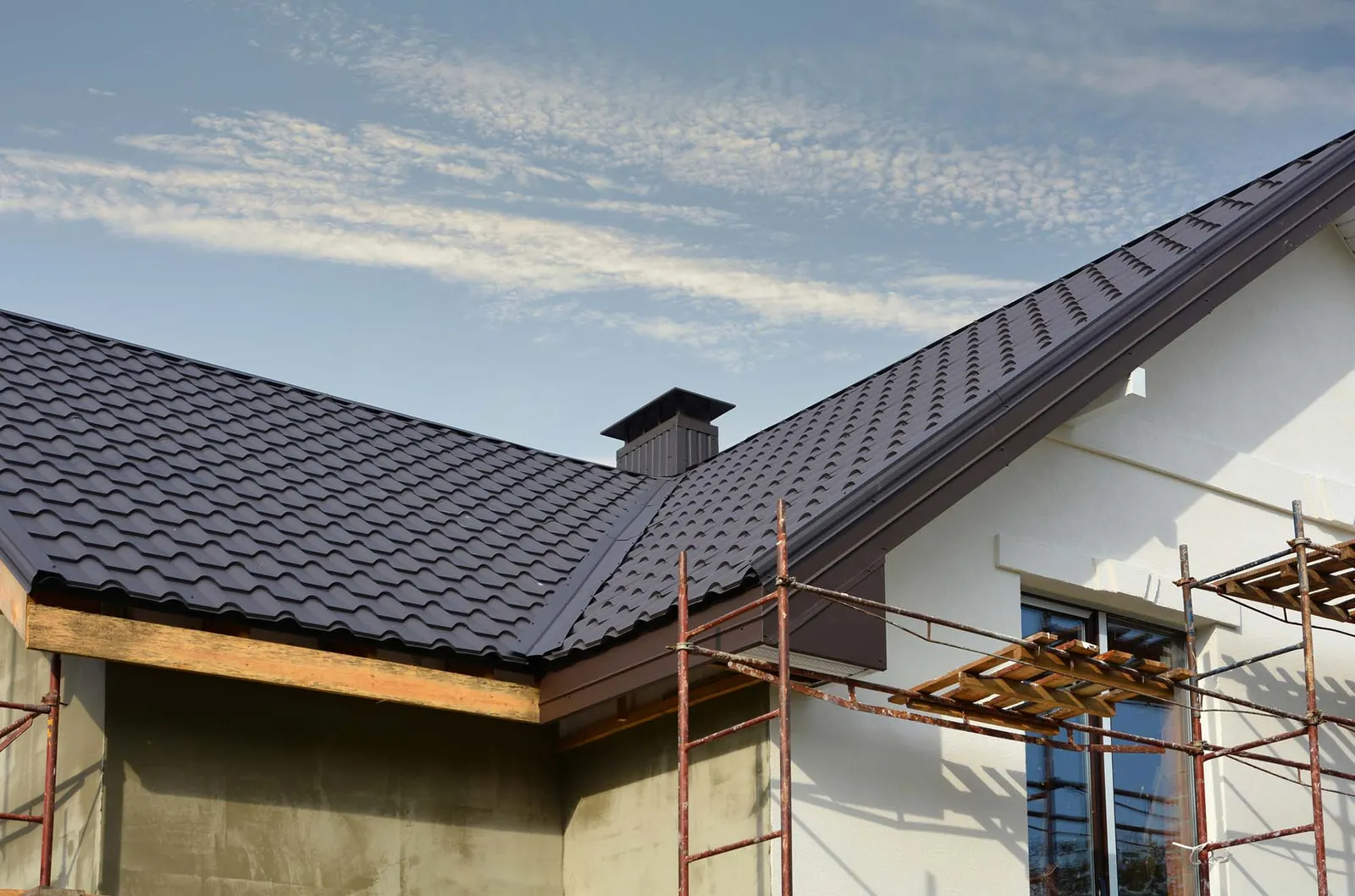 New installed grey tiles roof on home
